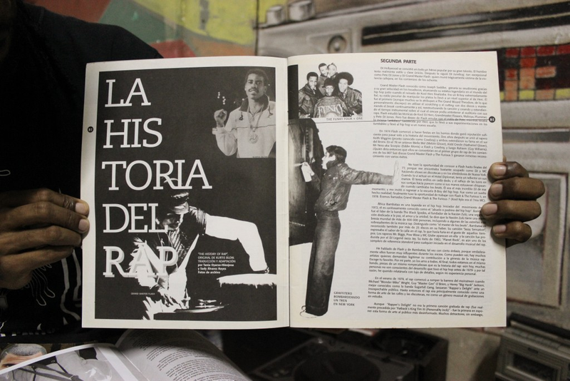 DJ Jigüe holds up a copy of the hip-hop magazine put out by the state-run rap label in Cuba. By Janice Llamoca